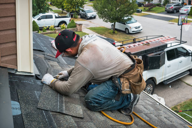 Professional Roofing technician working in Baldwin Place, NY